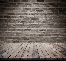 Dark wood table with abstract old brick wall background for product display