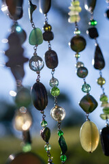 dreamcatcher made of wool feathers and stones in the field with natural sunlight with C&oacute;rdoba Argentina