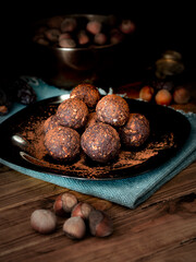 
Homemade energy balls of nuts and cocoa, dark photography of food