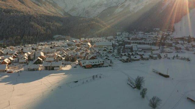 Kranjska gora in winter with snow and sun shining. Aerial view.
