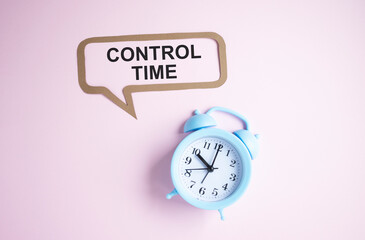 Control Time text on pink background near blue alarm clock.