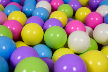 Closeup shot of colorful dry pool balls one on another