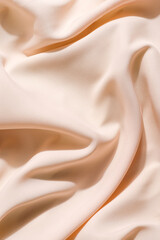 beautiful silk fabric of delicate pastel color, light orange, draped with small folds, softly...