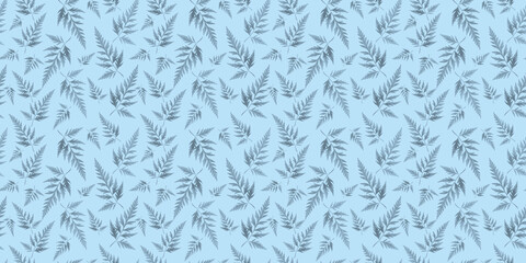 Floral background. Repeating pattern. Botanical banner. Pattern from leaves on a blue background. The leaves are real, not painted. Inspiration from nature.