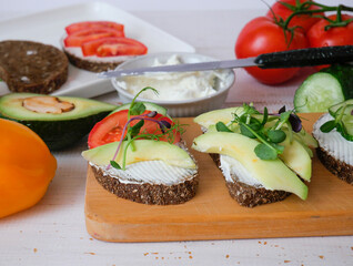 Sandwich on a tray. Sandwich with red fish and herbs. A sandwich. Morning sandwich. Copyspace