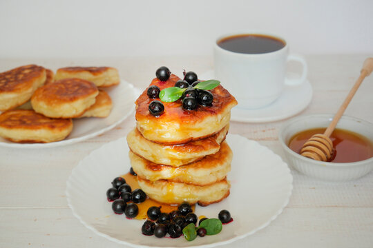 Pancakes. Stack of pancakes topped with roses jam butter. Breakfast.Pancakes. Stack of pancakes topped with roses jam butter. Breakfast.
