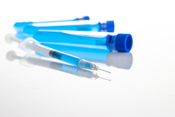 Syringe injection. Medical syringe with needle for protection flu virus and coronavirus. Covid vaccine isolated on white. Nurse or doctor. Liquid drug or narcotic.