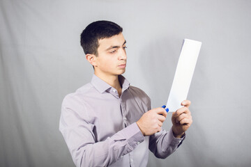 Stapler punctures sheets of paper