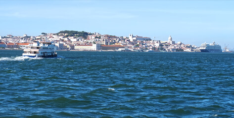 Fototapeta na wymiar Beautiful cityscape panorama of Lisbon seen from Tejo river