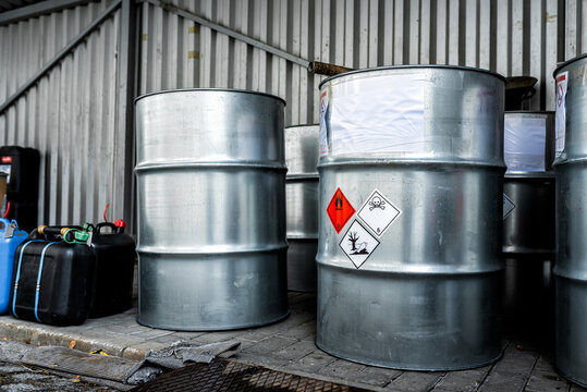 Big metal barrels containing hazardous chemicals from laboratories, business and industry background, waste management topic