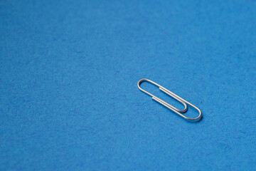 paper clip on blue