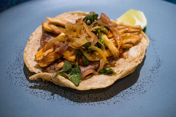 Taco Gaonera - a delicious taco made with grilled beef (Bistec) and topped with French fries.