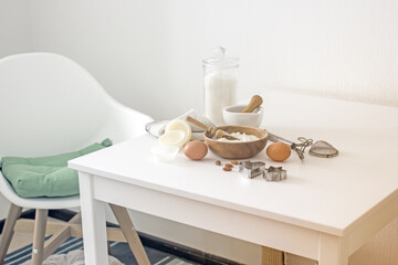 Baking ingredients on the kitchen table. Making homemade baked goods in the kitchen, authentic food photo. Home hobby baking