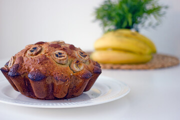 Homemade gluten free cake made from alternative flours, sugar free with banana and nuts on a white...