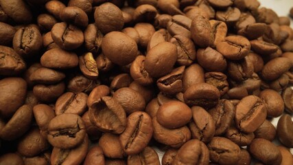 Roasted aromatic brown coffee beans. A very close-up of coffee beans.