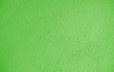 Abstract grainy texture on green wall. It can be used as a design element and background