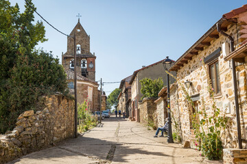 Calle Real street with the parish church in Rabanal del Camino, municipality of Santa Colomba de...