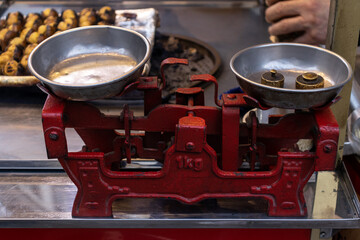 Metallic Old-time Balance Scale for weighing food. Retro Street market equipment.