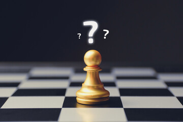 Confusion concept with question marks above a chess piece
