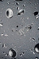 Black and White Oil and Water Abstract Wallpaper Background Texture. Oil Bubbles and blobs containing lots of bright vibrant beautiful designs. Unique fun image.