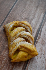 Baked strudel, bakery products on wooden table
