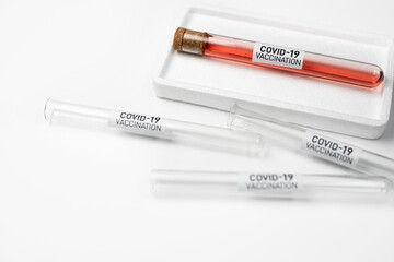Glass medicine bottles with injection fluid with blue aluminium caps for vaccination. Cancer, coronavirus covid-2019, painand diabetes treatment, pharmaceutical medicine concept