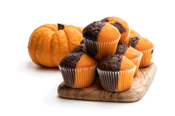 Fresh pumpkin and chocolate minimuffins with pumpkin isolated on white