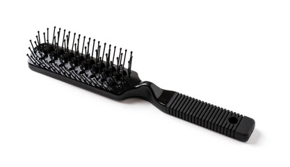 New black hair brush with handle isolated on white background. Combing and hair care, hairdressing tools, haberdashery. Studio shot.