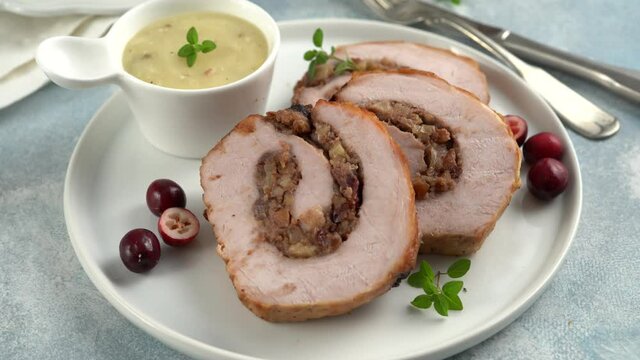 Pork loin roasted filled with cranberry bread stuffing
