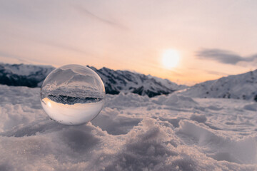 Sunset in the mountain with lensball. Panorama with golden sun.