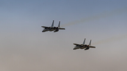 two jet fighters in flight