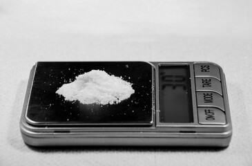 white powder weighed on a scale