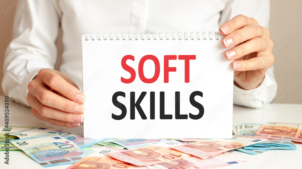 Poster a sheet of paper with text soft skills, multicolored markers on a white table. business and educatio