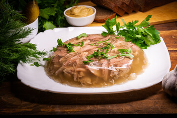 Traditional Russian meat aspic with mustard. Jellied meat.