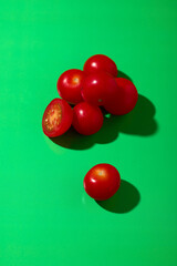 Tomatoes on a green background