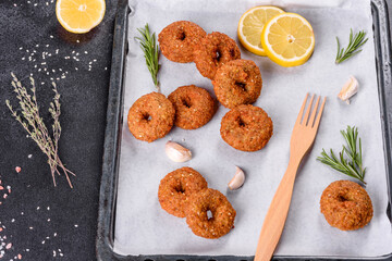 Beautiful delicious fresh chickpea falafel with sauces on a concrete background