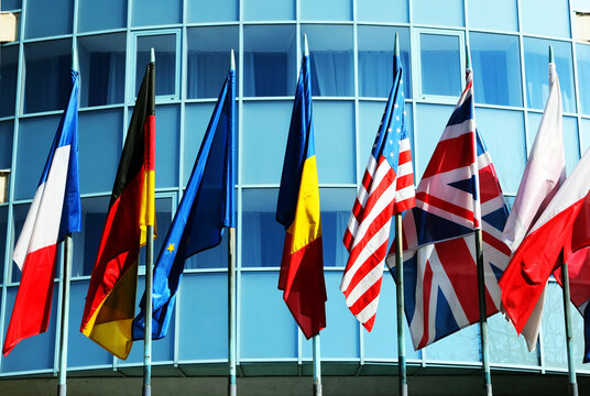 Image of a corporate building with different world flags