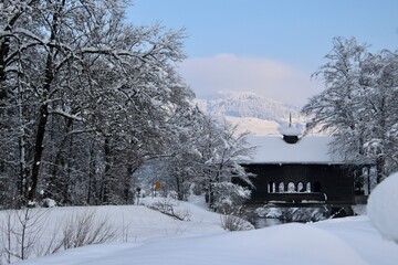 Old wooden bridge in the snowy landscape (Schmerikon, Switzerland)