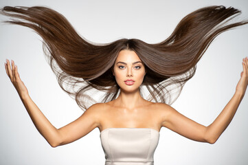 Portrait of a beautiful woman with a long straight hair.