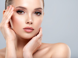 Closeup portrait of a  face of the young pretty girl with a healthy skin. Beautiful face of young...