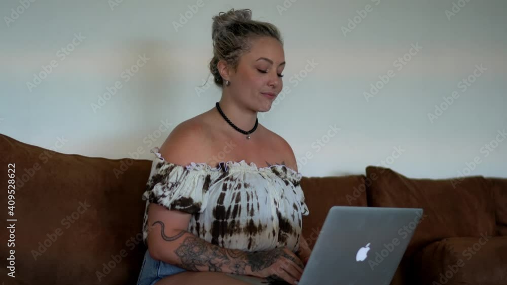 Poster happy female in casual wear working remotely on text project using laptop application for typing, po
