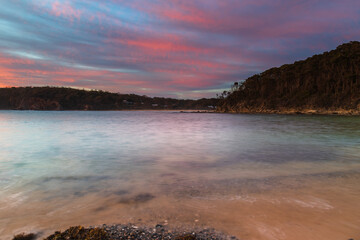 Colourful High Cloud Sunrise Seascape and Rock Formations