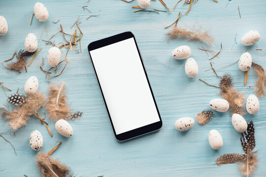 Happy easter background, holidays and object concept - close up of eggs and feathers on blue wood background - Powered by Adobe