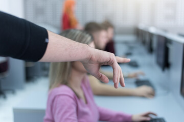 Teacher assisting college student in a computer lab. Technology and education, programming concept