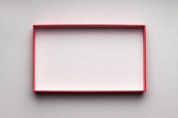 Lid of a cardboard box. Pink frame.