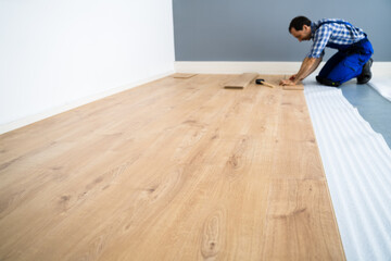 Worker Installing Home Floor