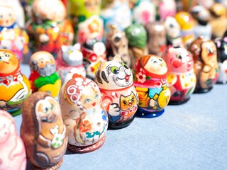 Tiny Matryoshka nesting dolls lined up on table