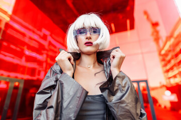 Fototapeta premium Woman in futuristic clothes for modern architecture.