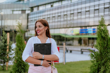 Woman with file folder in hands