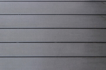 Background: modern silver gray timber piling, wood texture planks with uniform surface